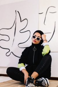 a luxury customer of the future posing in an art gallery